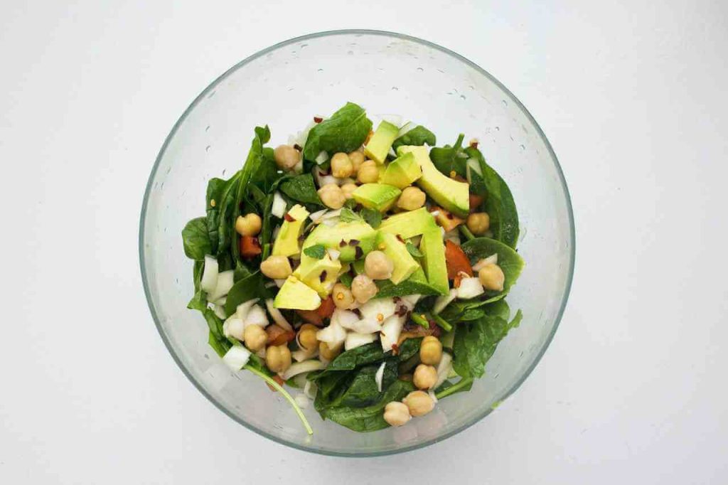 chickpeas and vegetables in a clear bowl