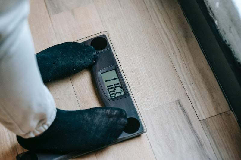 person on a weighing scale