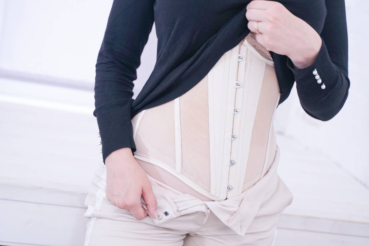 how to wear a waist trainer under clothes