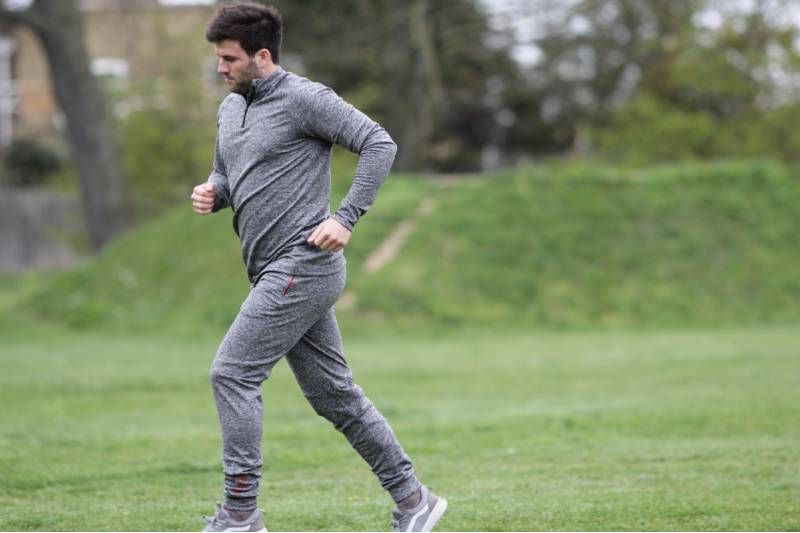 jogging man wearing gray sportswear