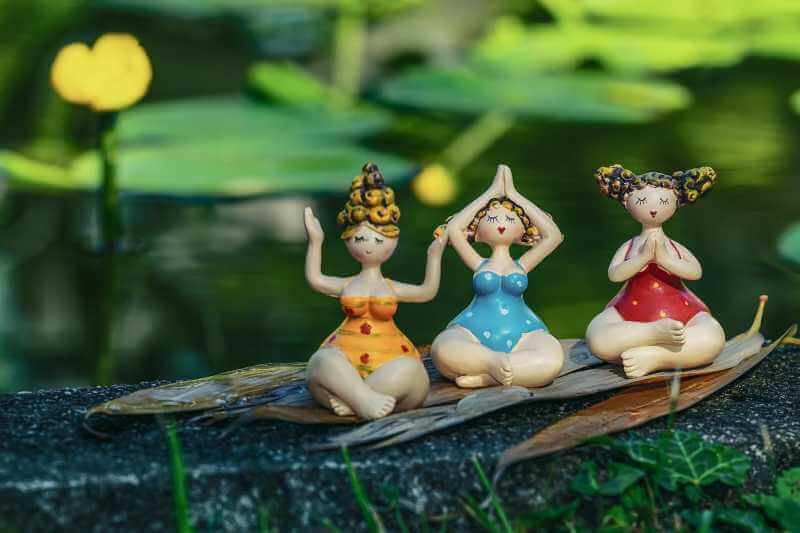 lady figurines doing yoga