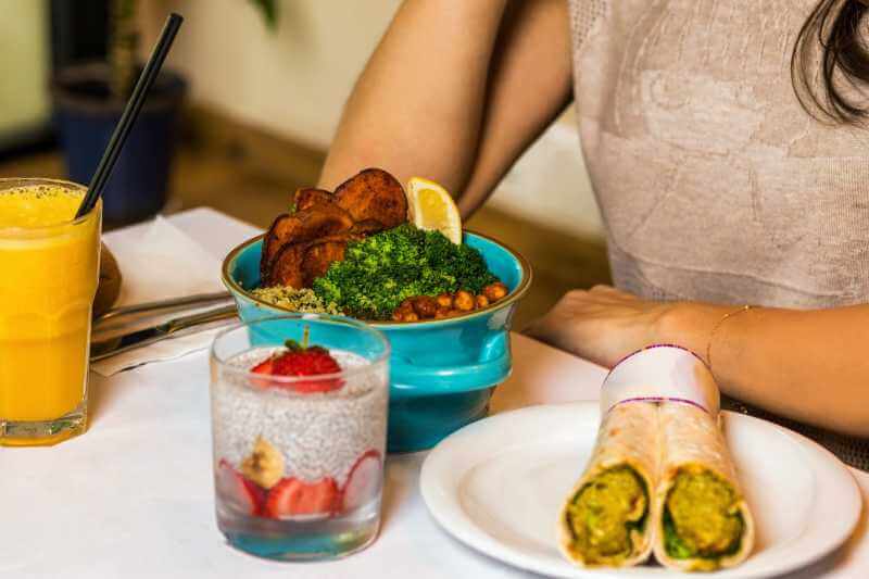 woman with a healthy meal on the table